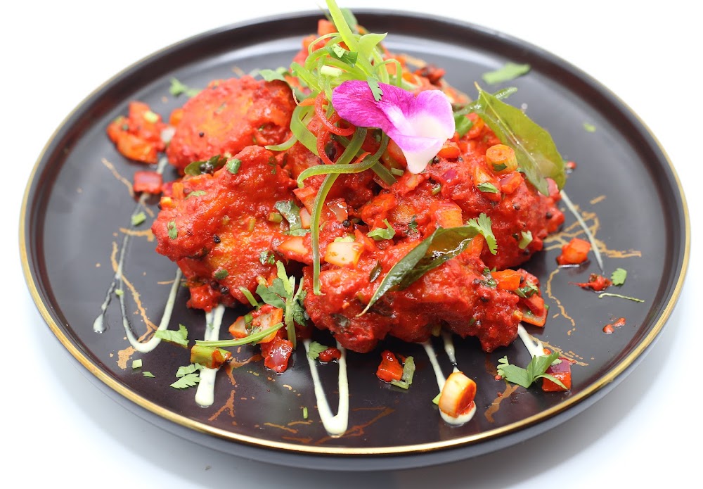 Delhi to Kathmandu Restaurant and Bar signature dishes Chicken 65Chicken Tikka MasalaPaneer 65